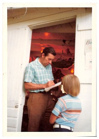 196x - Renting oars for boats, and running the PA. Nice combination of plaids.jpg